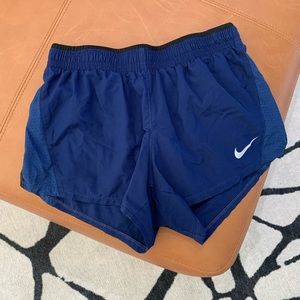 Blue Nike running shorts